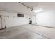 Large garage with concrete floor and shelving offers versatile space for storage and projects at 2647 N Miller Rd # 6, Scottsdale, AZ 85257