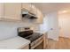 Modern kitchen featuring stainless steel appliances, stylish cabinets, and sleek countertops at 2647 N Miller Rd # 6, Scottsdale, AZ 85257