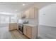 Updated kitchen featuring modern appliances, stylish cabinets, and beautiful countertops at 2647 N Miller Rd # 6, Scottsdale, AZ 85257