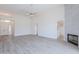 Open-concept living room with fireplace and luxury vinyl flooring throughout at 2647 N Miller Rd # 6, Scottsdale, AZ 85257