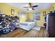 Bedroom featuring a ceiling fan, wood-look floors, and a full shoe rack at 2715 N 73Rd Dr, Phoenix, AZ 85035