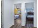 Hallway view showcases two bedrooms with modern finishes and ample natural light at 2715 N 73Rd Dr, Phoenix, AZ 85035