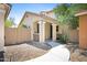 Inviting front exterior showcasing a charming porch and desert landscaping for low-maintenance appeal at 2715 N 73Rd Dr, Phoenix, AZ 85035