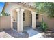 Inviting front exterior showcasing a charming porch and desert landscaping for low-maintenance appeal at 2715 N 73Rd Dr, Phoenix, AZ 85035