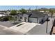 Bird's eye view of home featuring desert landscaping, solar panel, concrete driveway and an attached garage at 2790 W Cholla St, Apache Junction, AZ 85120