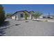 The backyard boasts a xeriscaped design, mature trees, and a clean, modern aesthetic, enhancing the outdoor space at 2790 W Cholla St, Apache Junction, AZ 85120