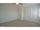 Bright bedroom with neutral walls, a ceiling fan, and two closets at 2790 W Cholla St, Apache Junction, AZ 85120