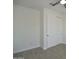 This bedroom features a ceiling fan and closet with modern sliding doors at 2790 W Cholla St, Apache Junction, AZ 85120