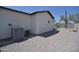 Exterior corner of home, showing the neutral stucco exterior and rock groundcover at 2790 W Cholla St, Apache Junction, AZ 85120