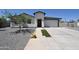 Charming single-story home with a low-maintenance landscaped yard, complemented by a modern, attached two-car garage at 2790 W Cholla St, Apache Junction, AZ 85120