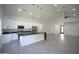 Bright kitchen opens to a large living area with ample space, and the kitchen has a large island with a black countertop at 2790 W Cholla St, Apache Junction, AZ 85120