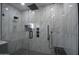 Luxurious glass shower featuring marble and black fixtures and finishes at 2790 W Cholla St, Apache Junction, AZ 85120