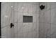 Modern tiled shower featuring black fixtures and a convenient inset storage niche at 2790 W Cholla St, Apache Junction, AZ 85120