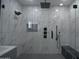 Luxurious glass shower featuring marble and black fixtures and finishes at 2790 W Cholla St, Apache Junction, AZ 85120