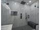 Luxurious glass shower featuring marble and black fixtures and finishes at 2790 W Cholla St, Apache Junction, AZ 85120