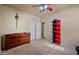 Bedroom with dresser, shelves, and neutral carpet at 3147 E Vallejo Dr, Gilbert, AZ 85298