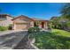 Charming single-story home featuring a well-manicured lawn and a welcoming front porch at 3147 E Vallejo Dr, Gilbert, AZ 85298