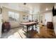 Spacious game room featuring a pool table, custom lighting, and unique concrete flooring at 3147 E Vallejo Dr, Gilbert, AZ 85298