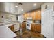 Well-lit kitchen features wooden cabinets, modern appliances, and ample counter space for cooking at 3147 E Vallejo Dr, Gilbert, AZ 85298