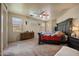 The primary suite features a ceiling fan, natural light and large bed at 3147 E Vallejo Dr, Gilbert, AZ 85298