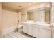 Bathroom with a single sink vanity, tub/shower combo, and neutral color palette at 333 E Caribbean Ln, Phoenix, AZ 85022