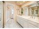 Bathroom featuring double sink vanity, large mirror, and ample storage at 333 E Caribbean Ln, Phoenix, AZ 85022