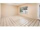 Sunny bedroom with a ceiling fan, large window overlooking the pool, and tile flooring throughout at 333 E Caribbean Ln, Phoenix, AZ 85022