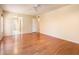 Comfortable bedroom features wood floors, a ceiling fan, and neutral paint, creating a cozy atmosphere at 333 E Caribbean Ln, Phoenix, AZ 85022