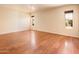 Spacious bedroom features wood floors, natural light from two windows, and neutral paint, creating a serene space at 333 E Caribbean Ln, Phoenix, AZ 85022