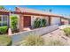 Charming home featuring a brick-accented entrance, desert landscaping, and a red tile roof at 333 E Caribbean Ln, Phoenix, AZ 85022