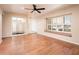 Bright living room featuring hardwood floors, a large window seat, and an atrium view at 333 E Caribbean Ln, Phoenix, AZ 85022