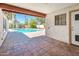 Covered patio overlooking a sparkling pool and lush backyard at 333 E Caribbean Ln, Phoenix, AZ 85022