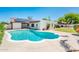 A private in-ground pool features a diving board and solar panels on the home's roof at 333 E Caribbean Ln, Phoenix, AZ 85022