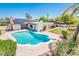 Aerial view of a private pool and patio area with a diving board and lush landscaping at 333 E Caribbean Ln, Phoenix, AZ 85022