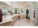 Spacious bathroom with double sinks, light wood cabinetry, and large mirrors at 33823 N 2Nd St, Phoenix, AZ 85085