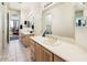 Bathroom with a double sink vanity, large mirror, and tile flooring at 33823 N 2Nd St, Phoenix, AZ 85085