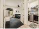 Bedroom with a laundry room, carpeted floors, and ceiling fan at 33823 N 2Nd St, Phoenix, AZ 85085