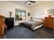 Bedroom with an outside view, carpeted flooring, and a ceiling fan at 33823 N 2Nd St, Phoenix, AZ 85085