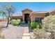 Charming home with well-maintained landscaping, a stone walkway, and a welcoming front entrance at 33823 N 2Nd St, Phoenix, AZ 85085