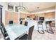 Spacious kitchen with light wood cabinets, stainless steel appliances, a large island, and adjacent dining area at 33823 N 2Nd St, Phoenix, AZ 85085