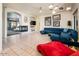 Open-concept living room featuring a fireplace, stylish decor, and seamless flow to adjacent spaces at 33823 N 2Nd St, Phoenix, AZ 85085