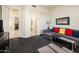 Cozy living room featuring a comfortable sofa and access to other rooms at 33823 N 2Nd St, Phoenix, AZ 85085