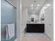 Stylish bathroom featuring double sinks, a large mirror, ample lighting, and a separate tub and shower at 37166 N El Morro Trl, San Tan Valley, AZ 85140