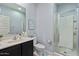 Clean, modern bathroom featuring a single sink vanity, toilet, and a glass-enclosed shower with tile surround at 37166 N El Morro Trl, San Tan Valley, AZ 85140