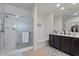 Modern bathroom with tub, walk-in shower, double sinks, and marble-look shower tile at 37166 N El Morro Trl, San Tan Valley, AZ 85140