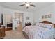 Inviting bedroom featuring a comfortable queen bed and natural light, offering a relaxing and private space at 37166 N El Morro Trl, San Tan Valley, AZ 85140