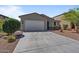 Single-story home with a two-car garage and well-maintained gravel front yard at 37166 N El Morro Trl, San Tan Valley, AZ 85140