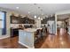 Spacious kitchen features granite countertops, stainless steel appliances, and a large island at 37166 N El Morro Trl, San Tan Valley, AZ 85140