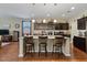Open kitchen featuring an island with bar seating and stainless steel appliances at 37166 N El Morro Trl, San Tan Valley, AZ 85140