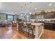 Open-concept kitchen and living room area with hardwood floors and modern finishes at 37166 N El Morro Trl, San Tan Valley, AZ 85140
